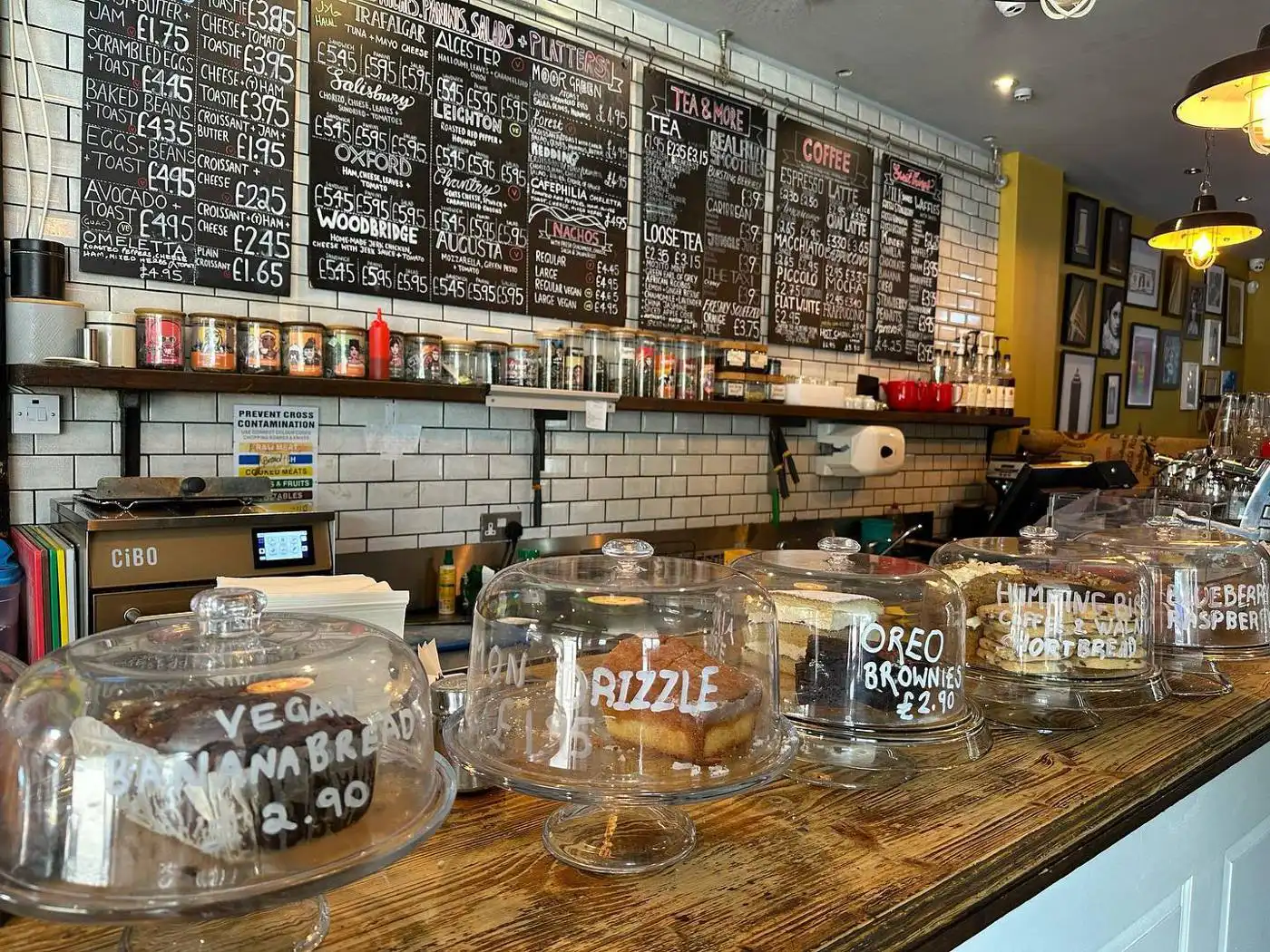 The cake counter under chalkboard menus