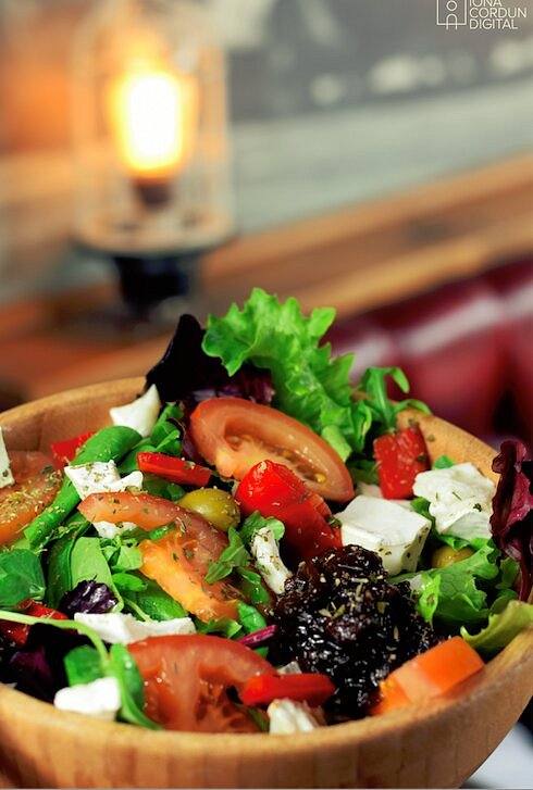 Salad bowl under a warm lamp